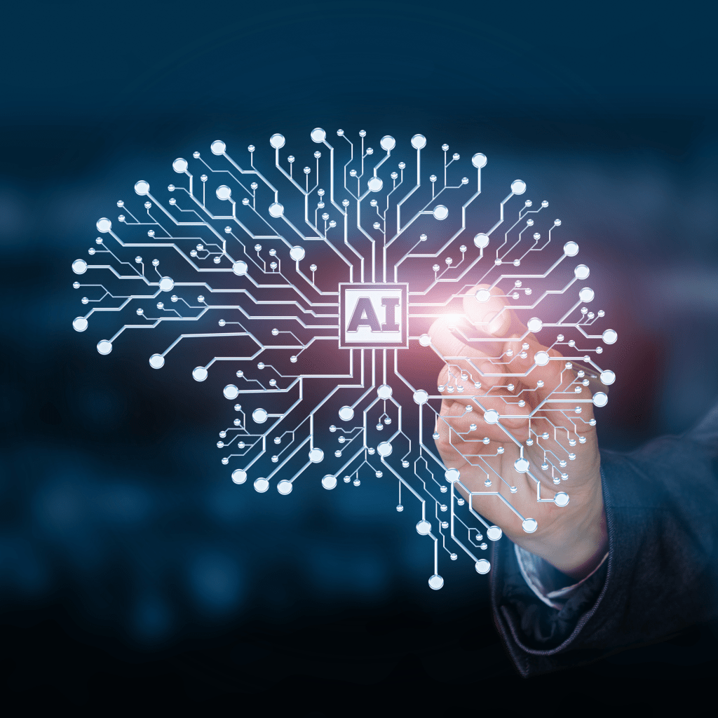 Grafica che mostra un cervello con il logo AI al centro e una rete neurale che lo forma; una mano in secondo piano lo tocca, causando un bagliore, a simboleggiare interazione con l’intelligenza artificiale.